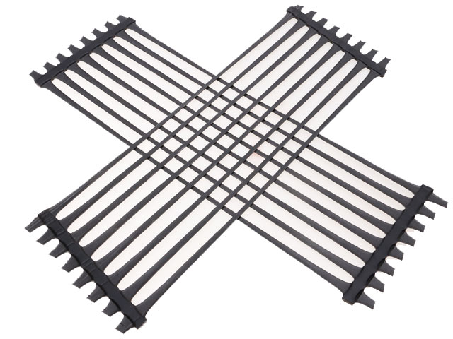 One-way tensile plastic geogrid roadbed reinforcement